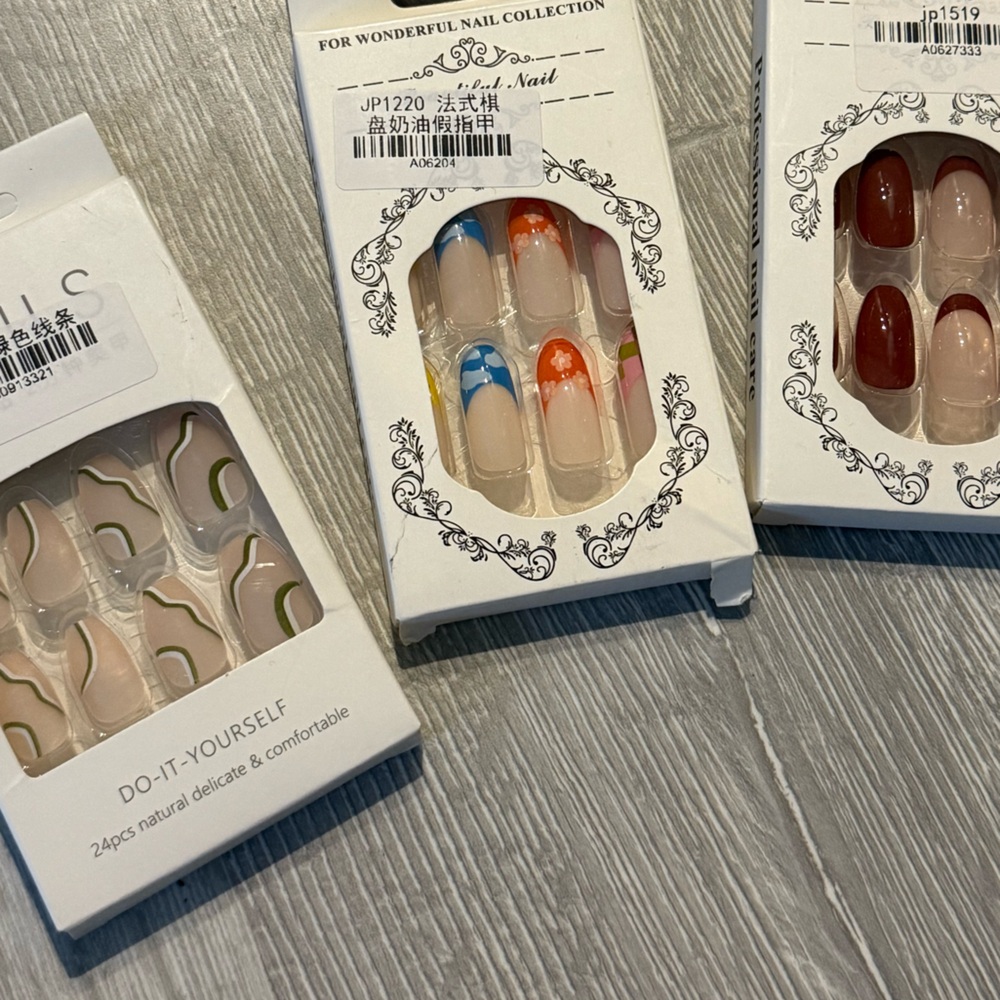 Elegant Nail Art Set with Red, Blue, and Nude Designs